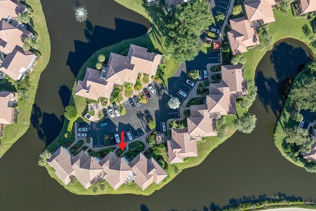 birds eye view of property with a residential view and a water view