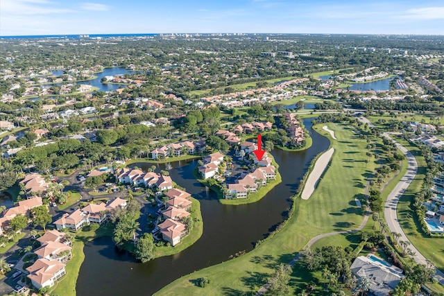 drone / aerial view with a water view and a residential view