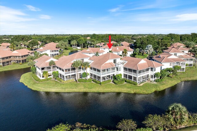 drone / aerial view with a water view