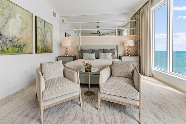 bedroom featuring visible vents, baseboards, and a water view