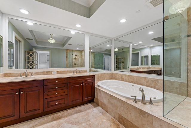 bathroom featuring double vanity, a shower stall, a garden tub, and a sink