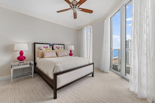 bedroom with crown molding, multiple windows, light colored carpet, and baseboards