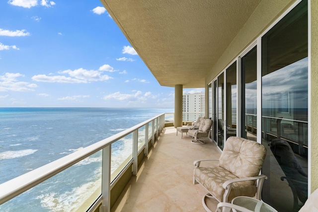 balcony featuring a water view