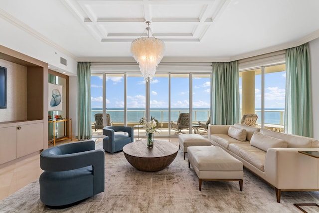 living area featuring visible vents, coffered ceiling, a water view, crown molding, and a notable chandelier