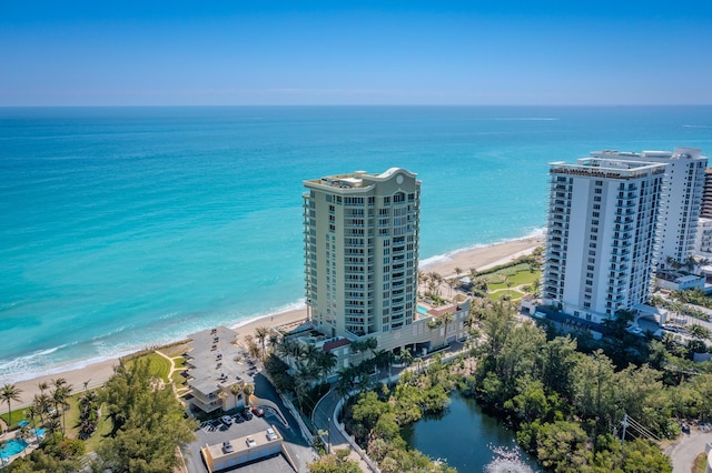 birds eye view of property featuring a water view, a city view, and a view of the beach