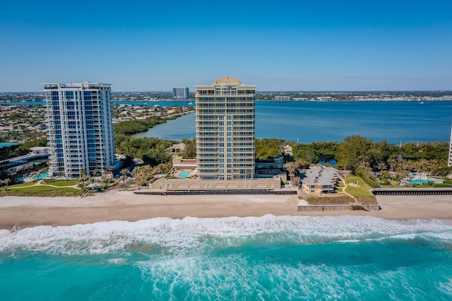 bird's eye view featuring a view of city, a view of the beach, and a water view