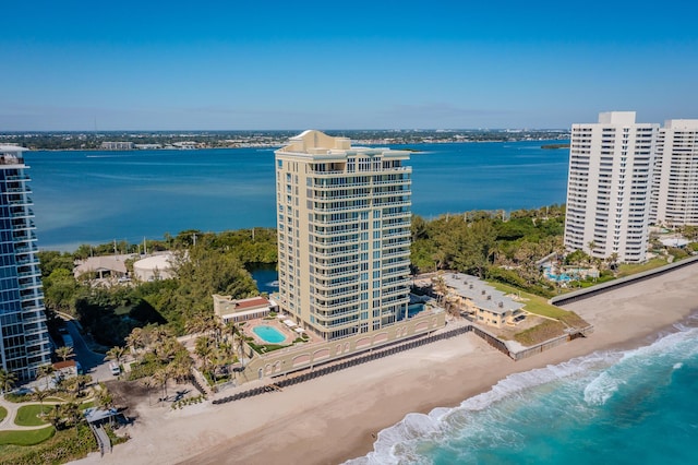 birds eye view of property with a water view and a city view