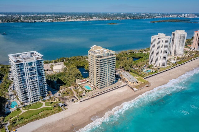 aerial view featuring a view of the beach, a view of city, and a water view