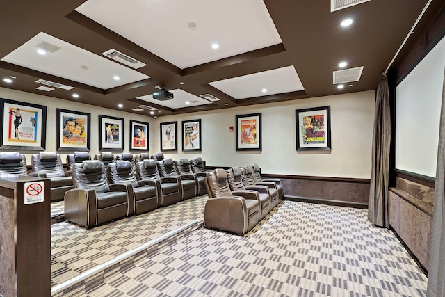 cinema room featuring visible vents, wainscoting, and light colored carpet