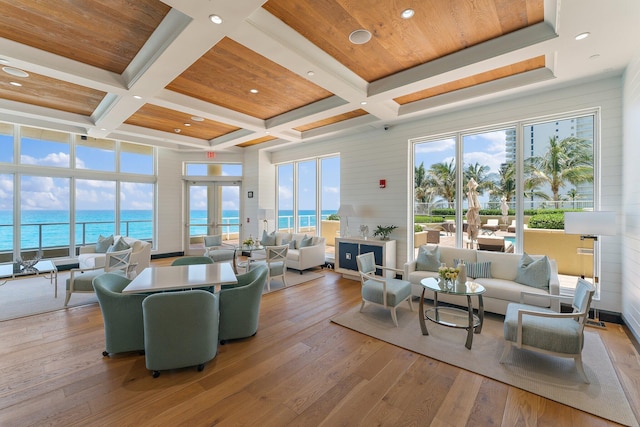 living area with coffered ceiling, wood ceiling, and hardwood / wood-style flooring