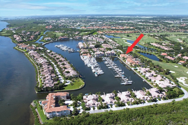 drone / aerial view featuring a water view and a residential view