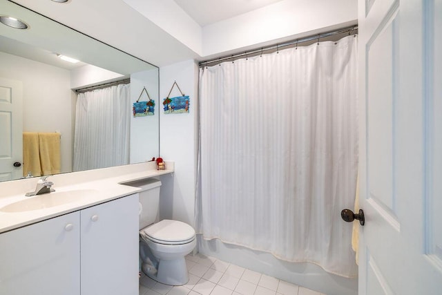 bathroom with tile patterned floors, toilet, vanity, and shower / tub combo with curtain