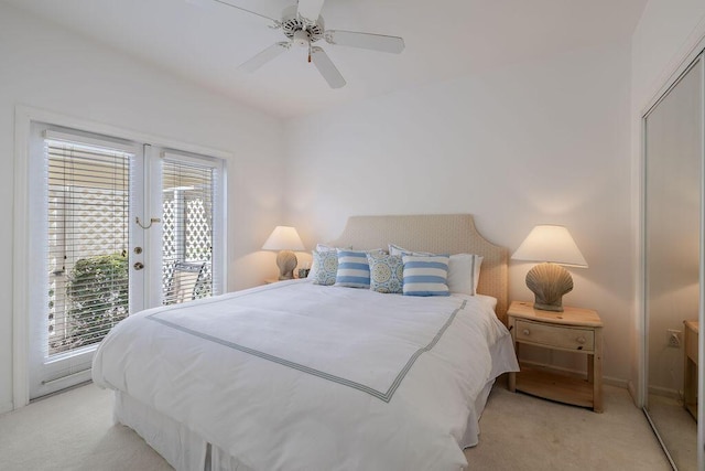 bedroom featuring french doors, light carpet, ceiling fan, and access to outside