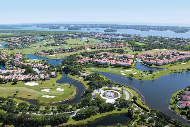 birds eye view of property featuring golf course view, a water view, and a residential view