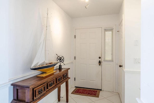 doorway with light tile patterned floors