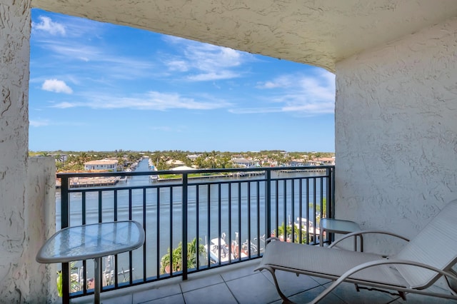 balcony featuring a water view