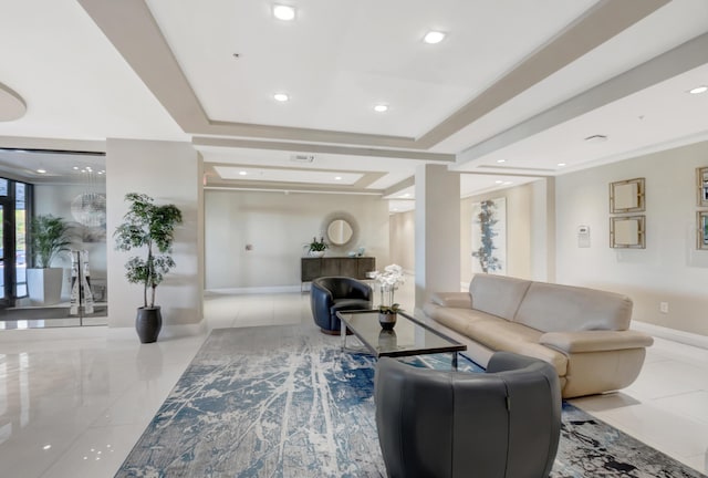 tiled living area featuring visible vents, recessed lighting, a raised ceiling, and baseboards