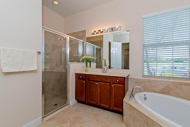 bathroom with tile patterned floors, a shower stall, vanity, and a garden tub