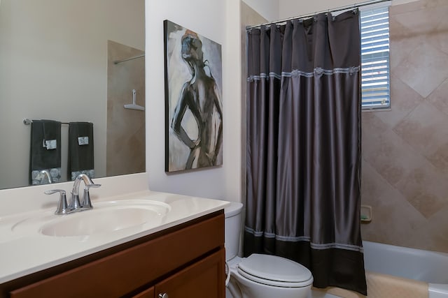 bathroom with shower / bathtub combination with curtain, toilet, and vanity