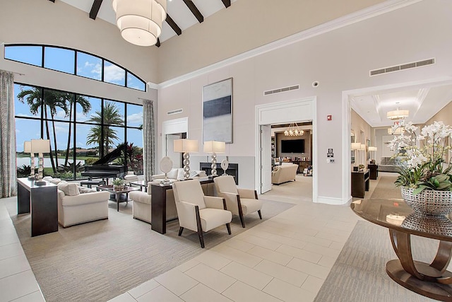 living room featuring tile patterned floors, beamed ceiling, visible vents, and a chandelier