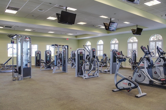 gym featuring visible vents and a paneled ceiling