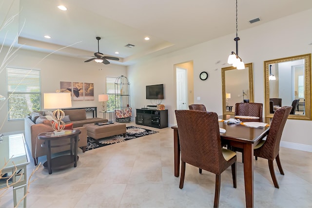 dining area featuring a wealth of natural light, visible vents, recessed lighting, and a raised ceiling