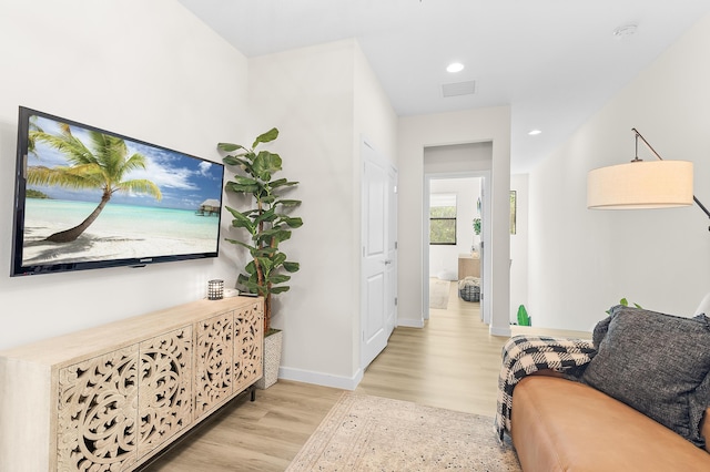 interior space featuring visible vents, recessed lighting, baseboards, and light wood-style floors