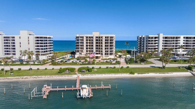 aerial view featuring a view of the beach and a water view