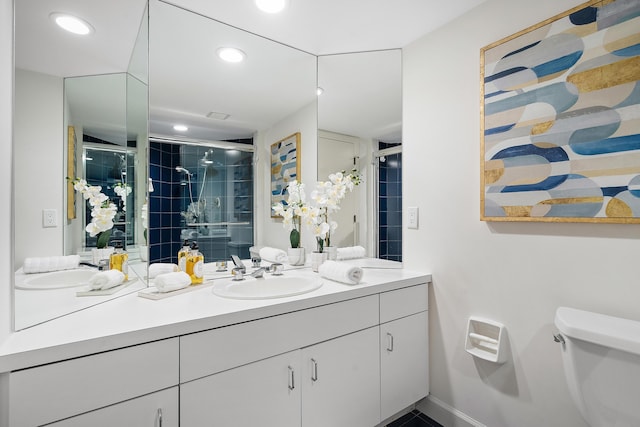 full bath featuring recessed lighting, a stall shower, toilet, and vanity