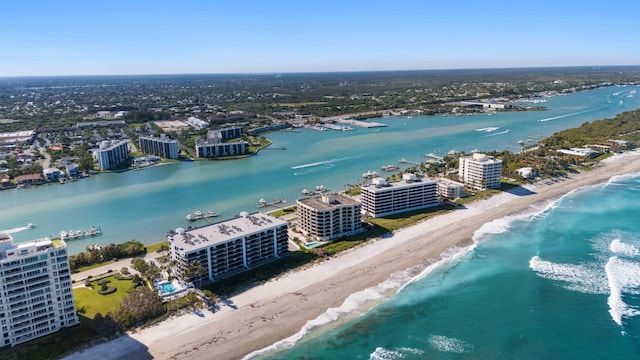 birds eye view of property with a city view, a beach view, and a water view