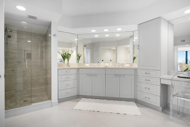 bathroom with vanity, a shower stall, recessed lighting, and visible vents