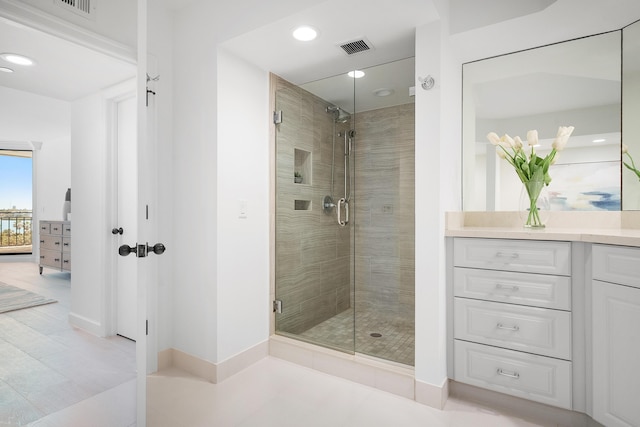 full bath featuring visible vents, a stall shower, recessed lighting, baseboards, and vanity