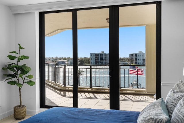 bedroom with baseboards and a view of city