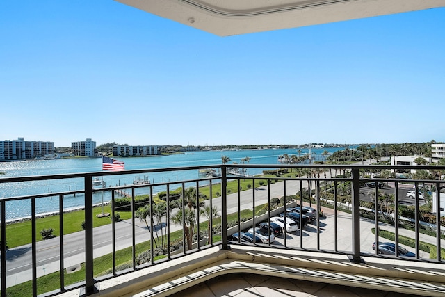 balcony featuring a water view