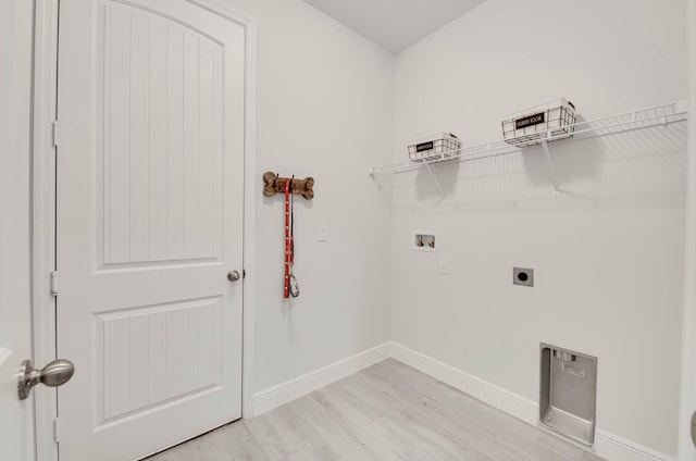 washroom featuring baseboards, laundry area, hookup for a washing machine, light wood-style floors, and electric dryer hookup