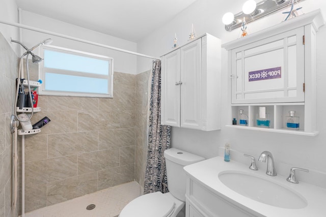 full bathroom with a shower stall, toilet, and vanity