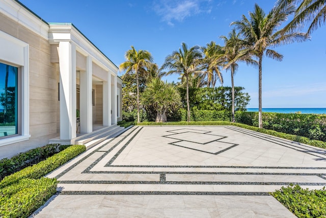 view of patio featuring a water view