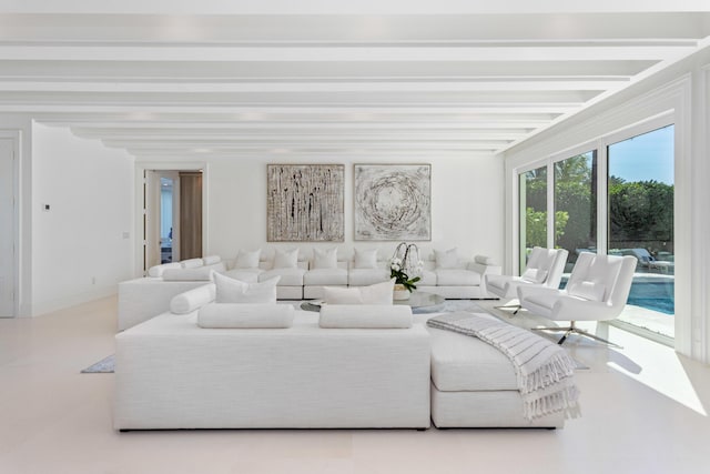 living area with beam ceiling and baseboards