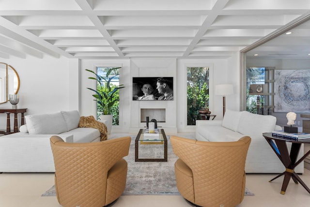 living area with beamed ceiling, coffered ceiling, and a healthy amount of sunlight