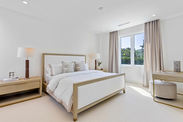 bedroom featuring recessed lighting, visible vents, and light carpet