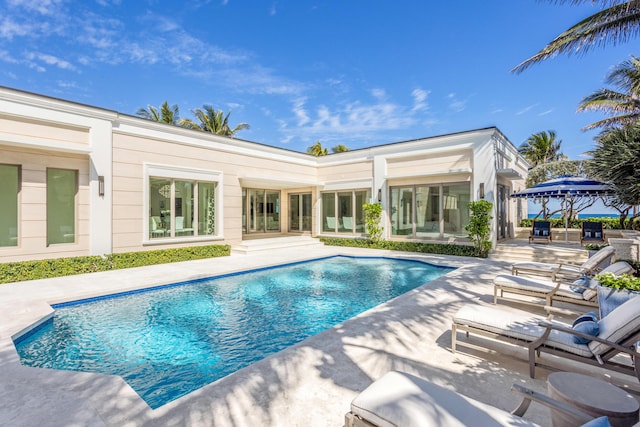 pool featuring a gazebo and a patio area