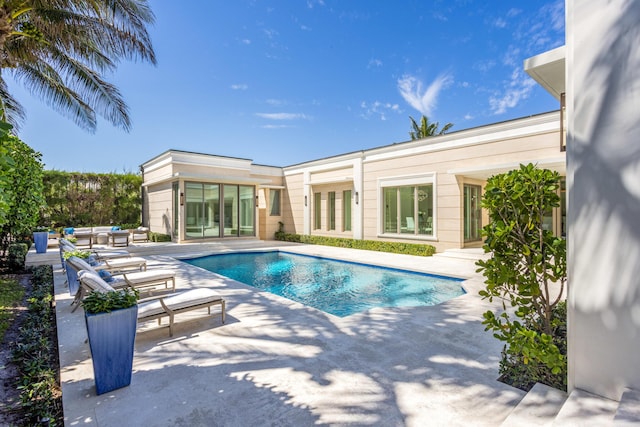 outdoor pool featuring a patio area