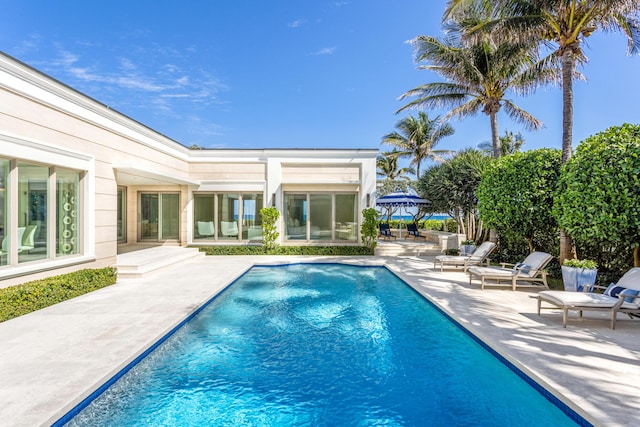 outdoor pool featuring a gazebo and a patio