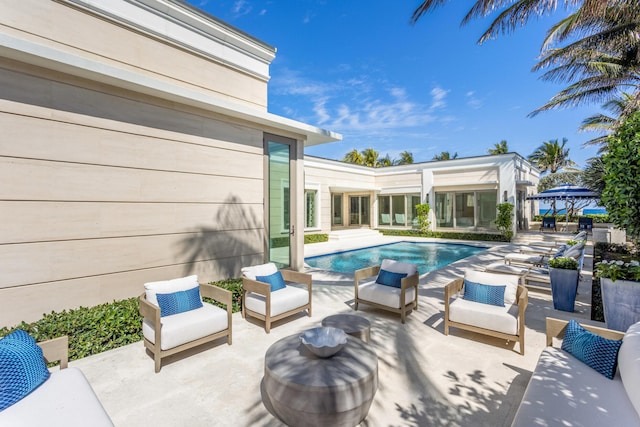 view of patio with outdoor lounge area and an outdoor pool