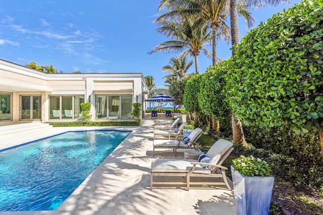 pool with a gazebo and a patio