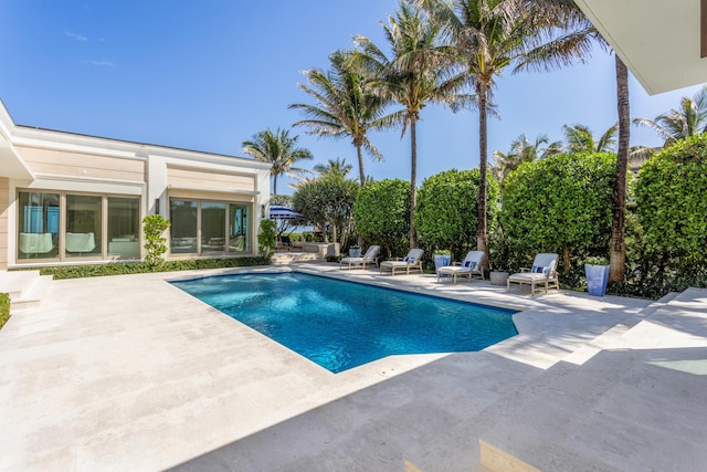 outdoor pool with a patio