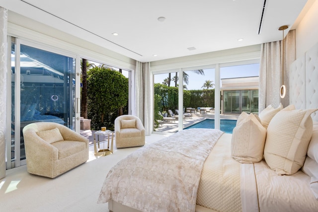 bedroom featuring access to exterior and carpet flooring