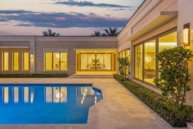 pool with a patio area