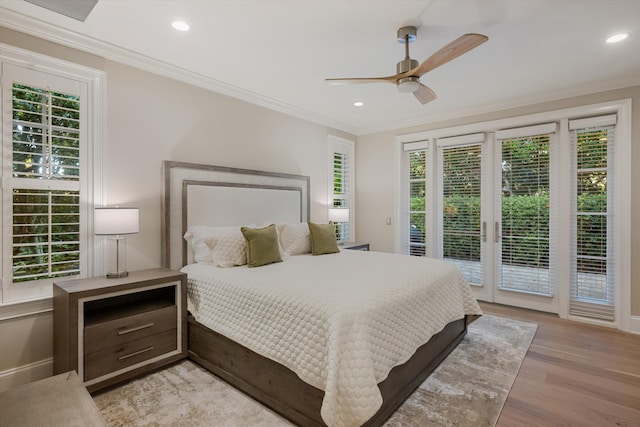 bedroom featuring recessed lighting, light wood-style floors, access to exterior, and ornamental molding