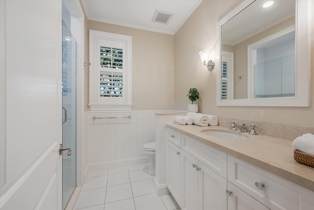 full bathroom with visible vents, a wainscoted wall, ornamental molding, a shower stall, and tile patterned floors